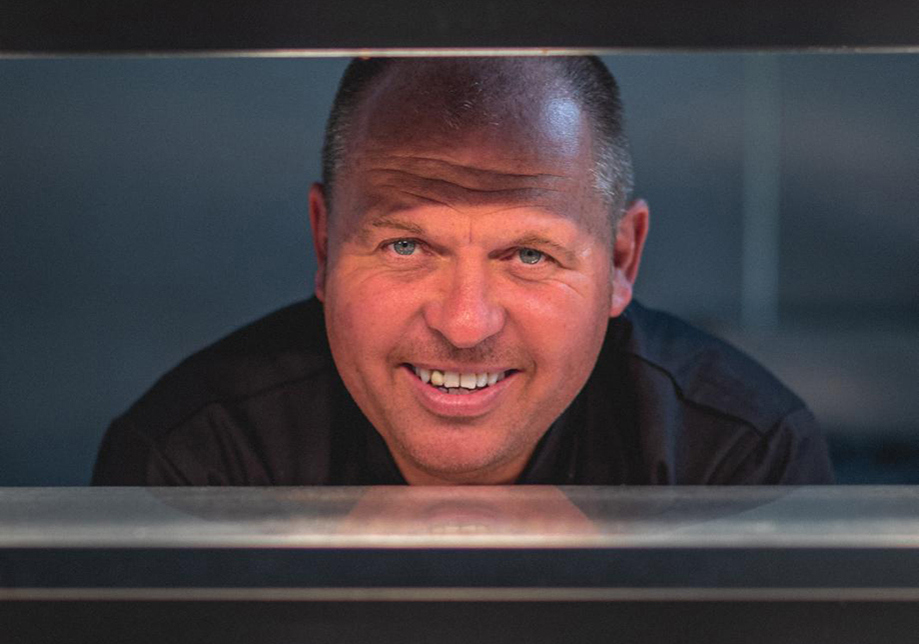 Food Creations wedding catering chef smiling in a professional kitchen