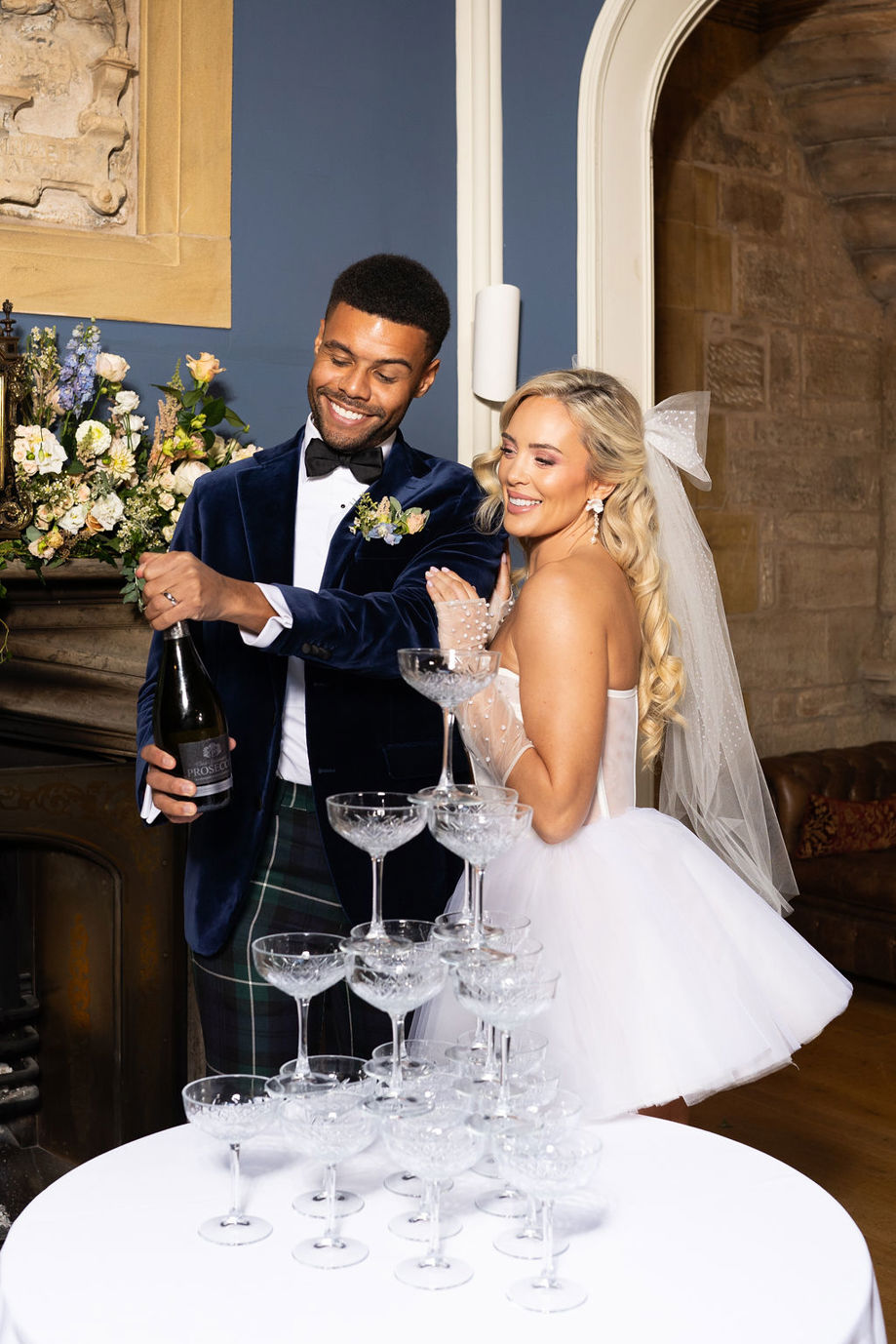 Bride and groom pop champagne for Pure Bartending champagne tower