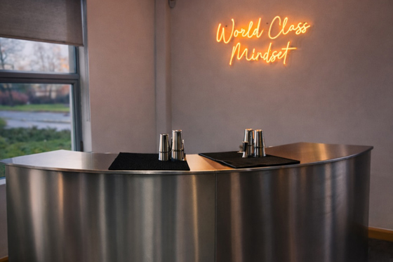 Curved mobile bar by Sips Events styled with neon lighting for private parties and corporate functions.