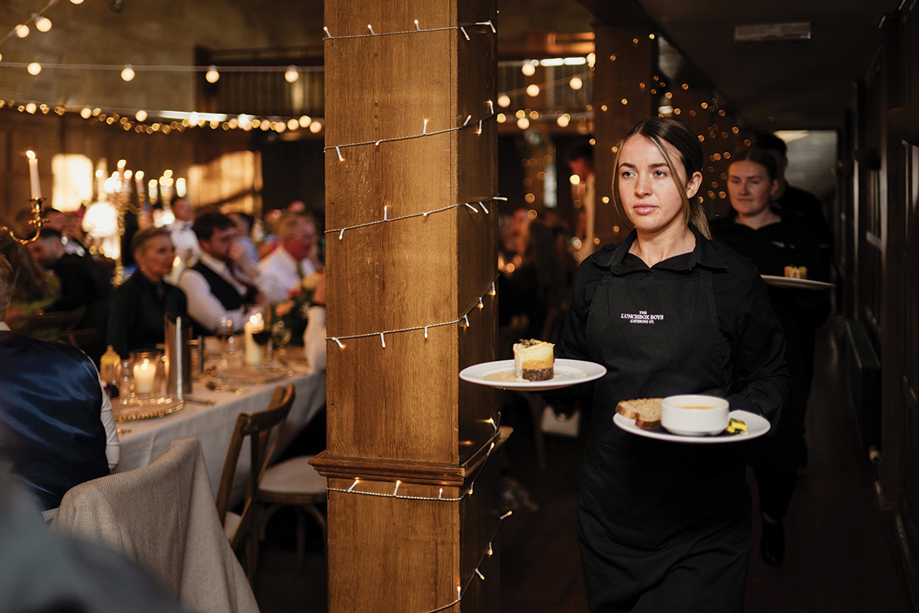 The Lunchbox Boys employees walk out to give guests plates.
