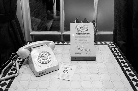 Calleo phone with sign asking to leave a message for the happy couple
