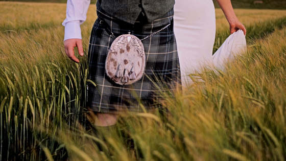 scottish-highland-wedding-cinematography-groom-kilt-bride-cornfield