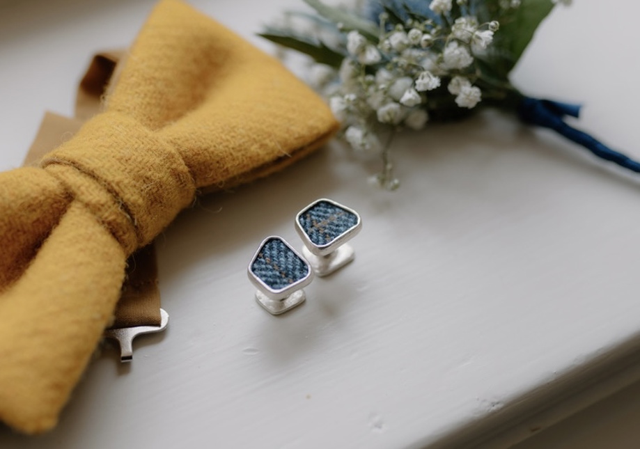 Harris tweed cufflinks, with mustard yellow bow tie and carnation buttonhole 