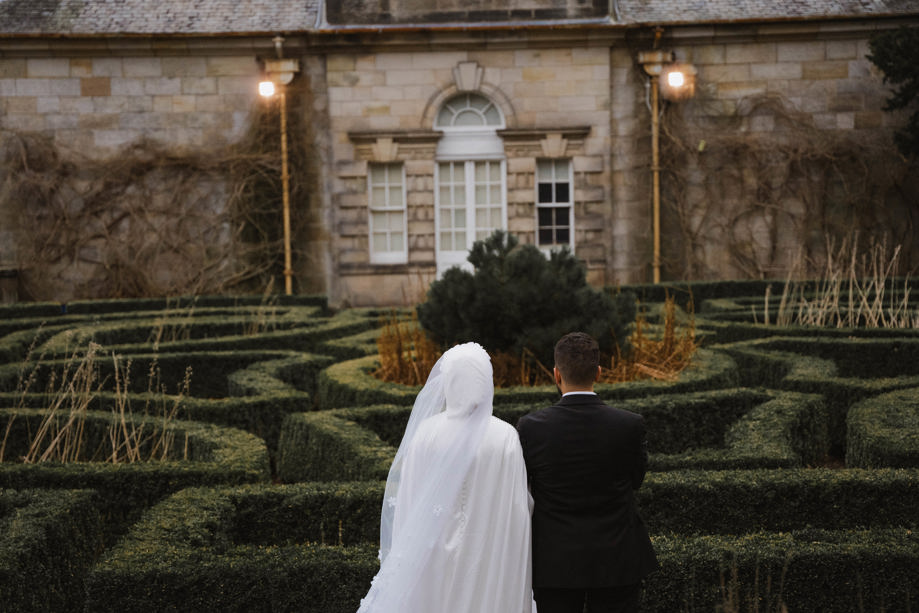 View from behind of bride and groom in Parterre gardens