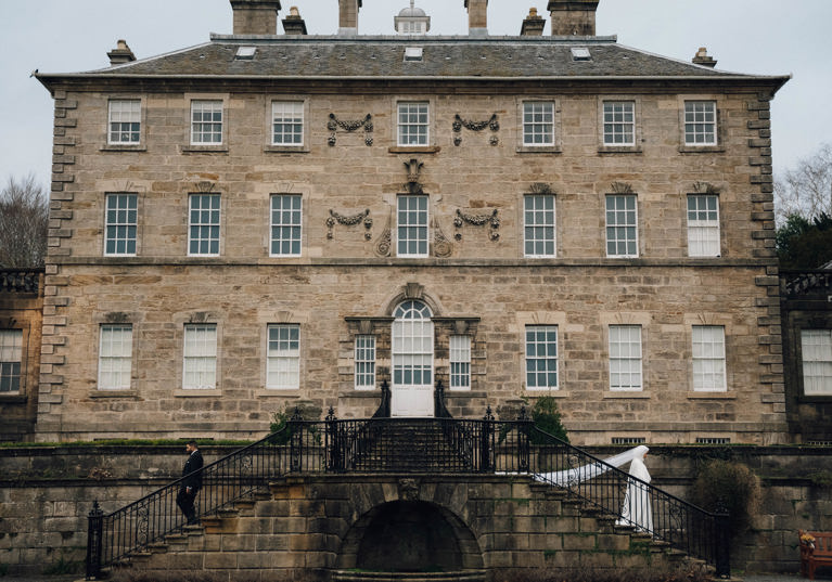 View of venue with bride walking down outdoor steps