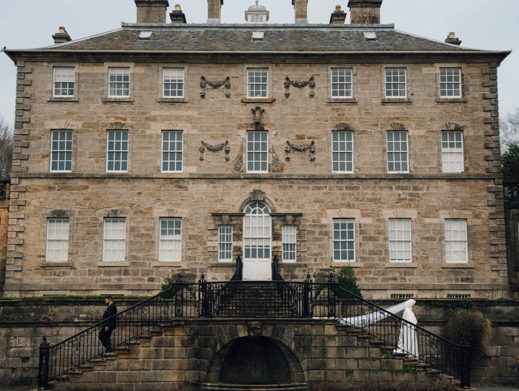 View of venue with bride walking down outdoor steps