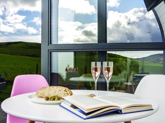 Celebrate on the decking with two glasses of rosé and some snacks at Maycroft Retreat.