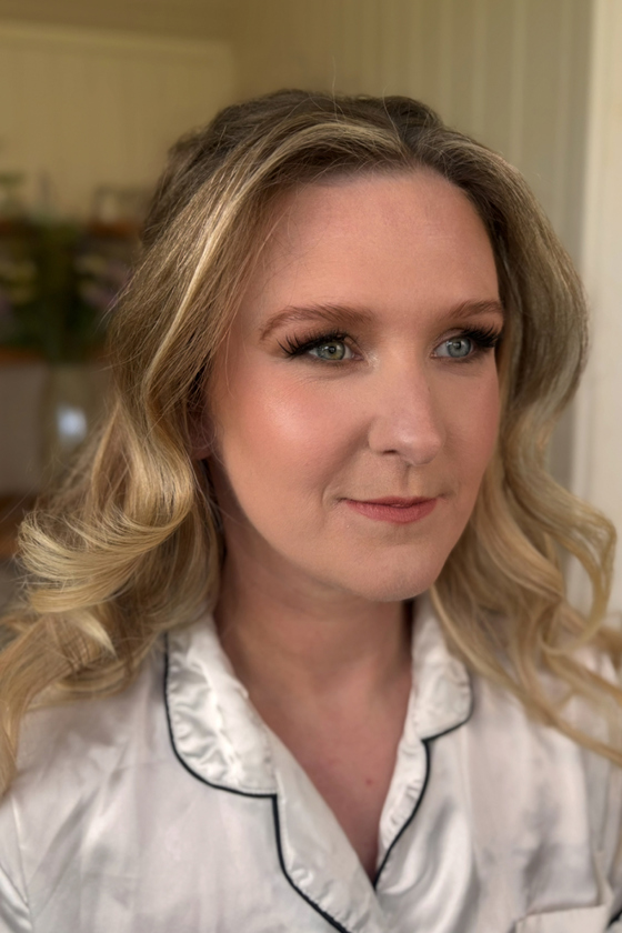 Bride smiles after wedding day makeup done by Jill Rowan Makeup.