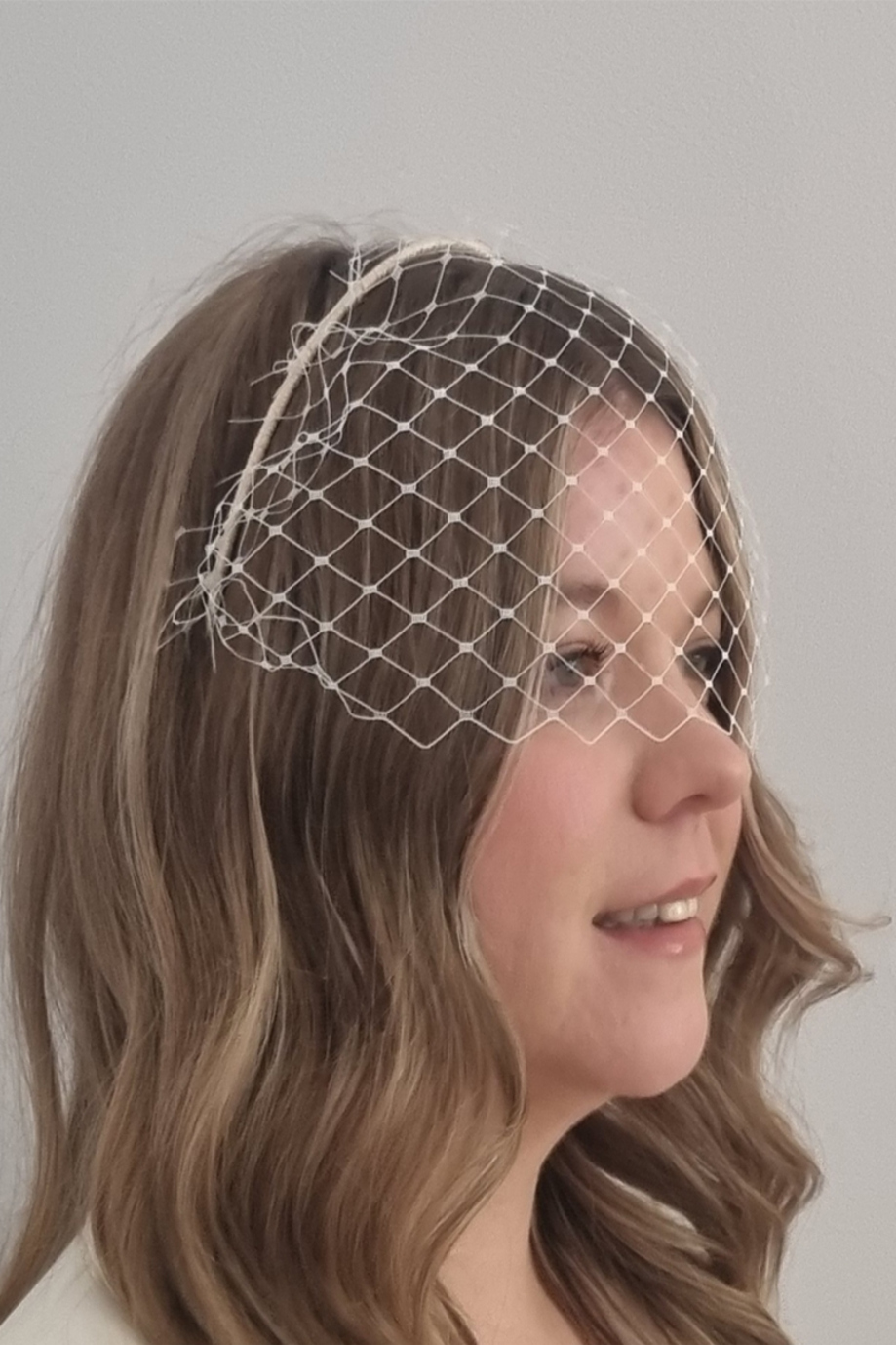Bridal face veil in ivory by Hazel Goodwin Millinery