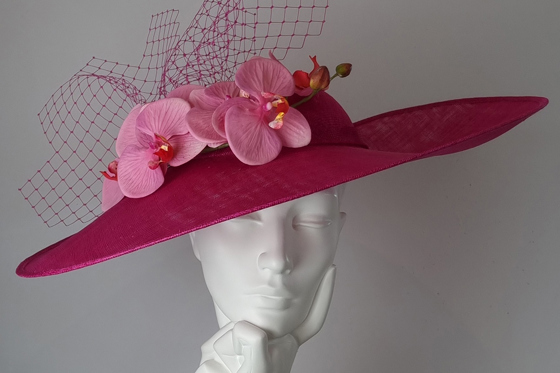 Fuschia sidesweep hat with baby pink orchids and pink veil at Hazel Goodwin Millinery