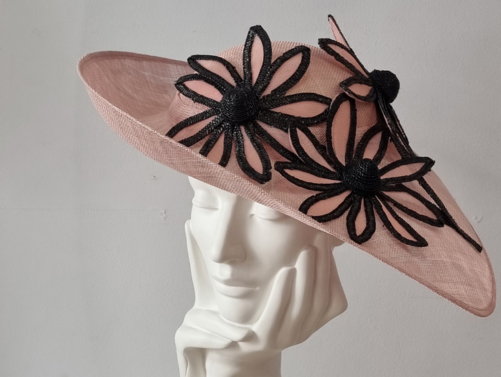 Pink hat with black flowers at Hazel Goodwin Millinery in Glasgow