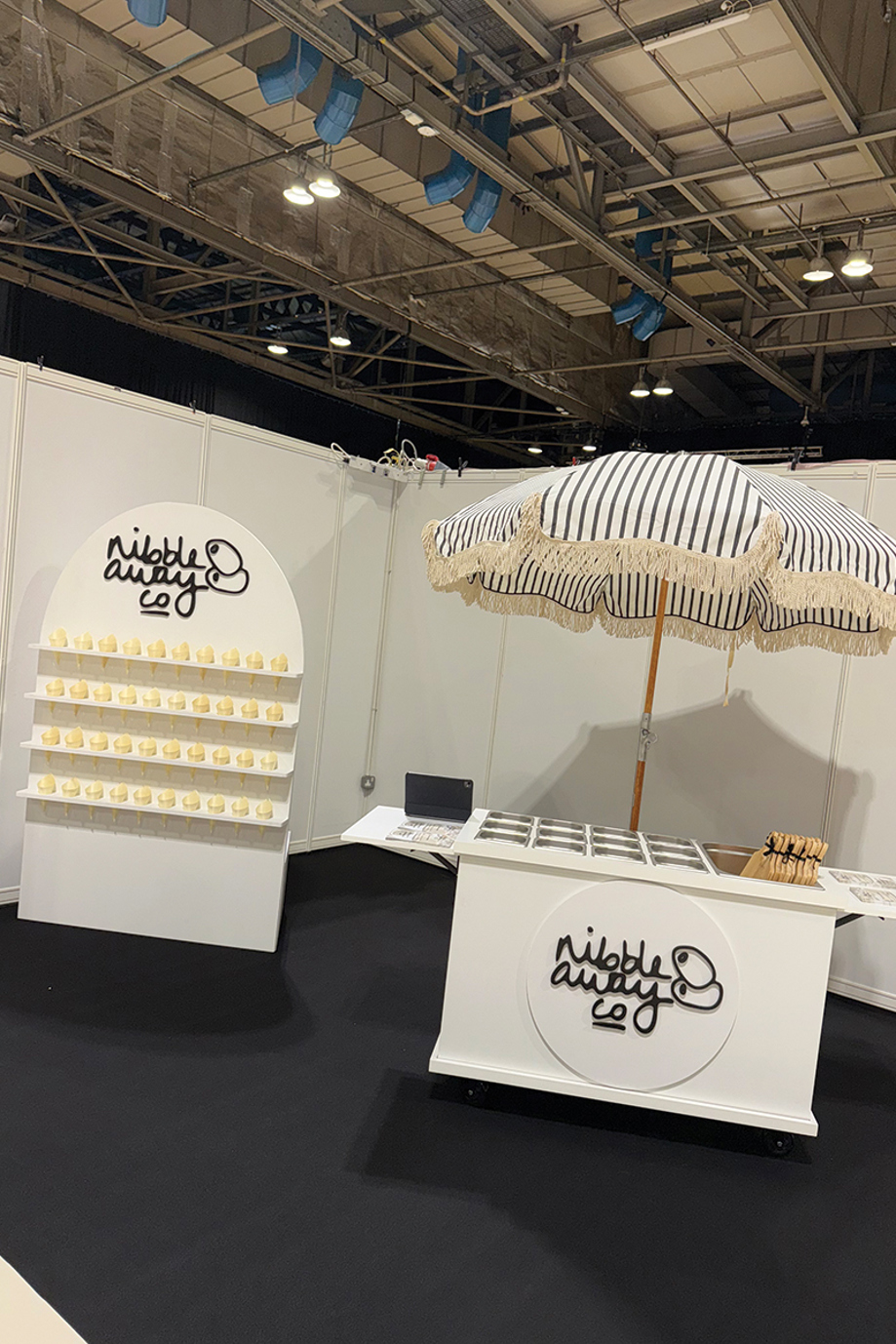 Nibble Away Co wedding grazing cart with striped parasol and branded display, set up for a Scottish wedding food station