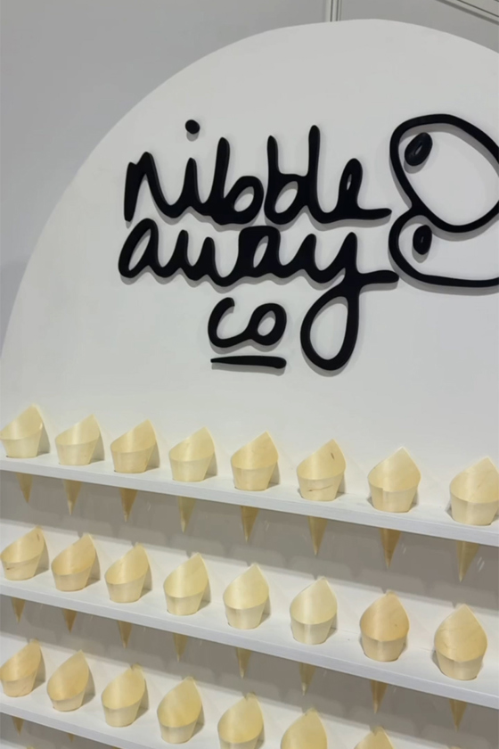 Nibble Away Co branded wedding catering stand with grazing cups displayed, specialist Scottish wedding caterer