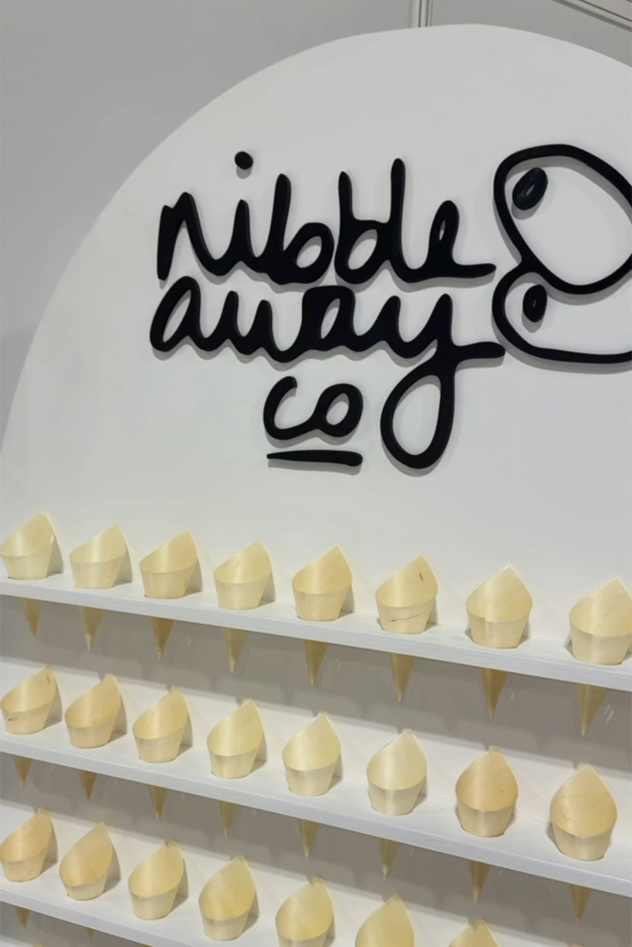 Nibble Away Co branded wedding catering stand with grazing cups displayed, specialist Scottish wedding caterer