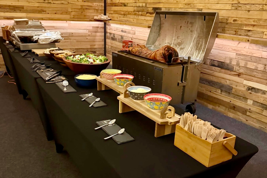 Rustic hog roast catering station with salads and sides set up for a Scottish wedding by The Tasty Hog Company