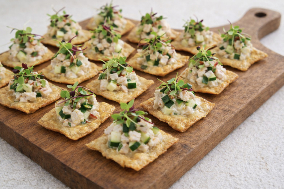 Seafood canapé bites on crisp crackers with cucumber and microgreens served at a Scottish wedding by The Tasty Hog Company