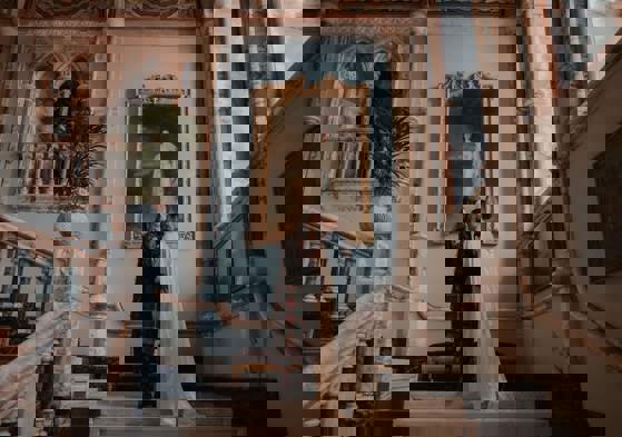 The newly wed couple sharing a quiet moment together on the marble staircase before being called into dinner