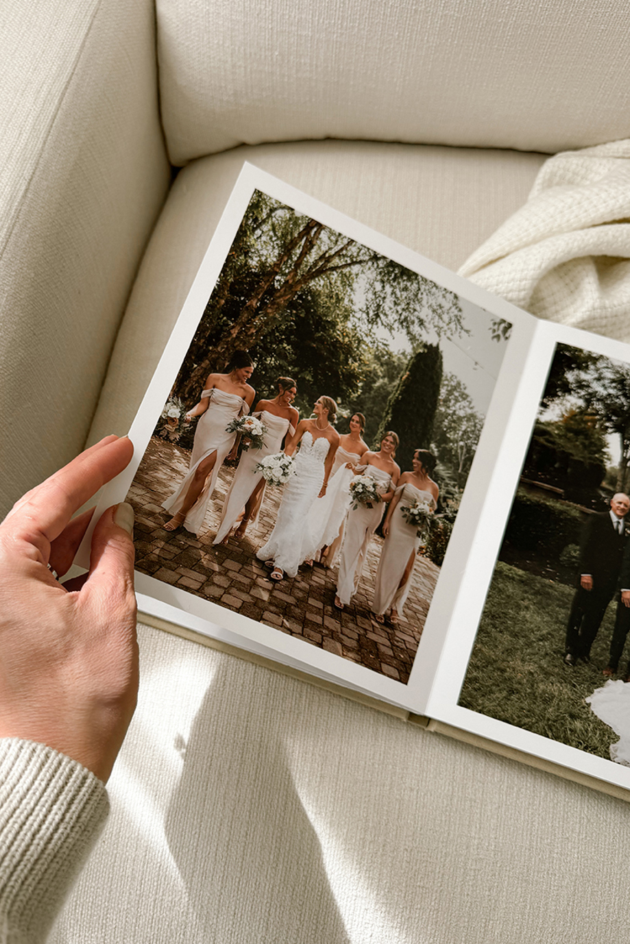 Inkifi wedding photo album featuring bridal party photographs displayed across a premium layflat spread