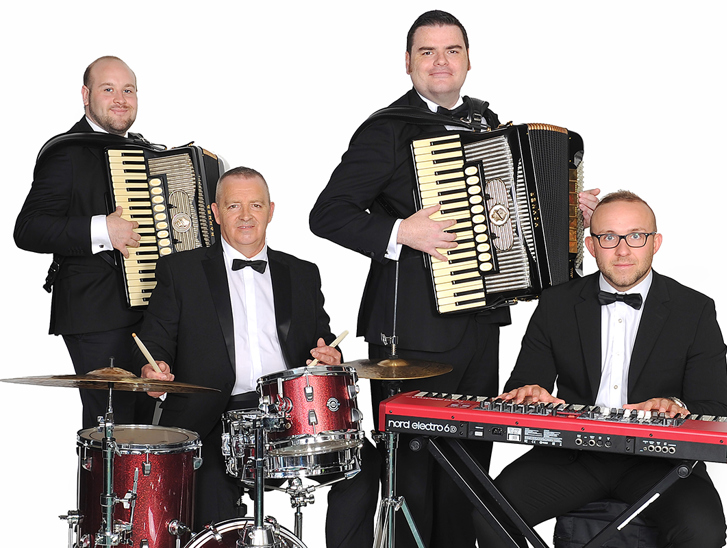 The Liam Stewart Band posing with instruments including accordion, keyboard and drums.
