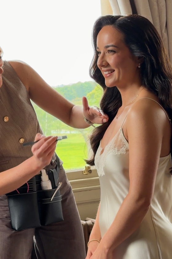 Navae Creative wedding content creator capturing a bride having final makeup touches on the wedding morning