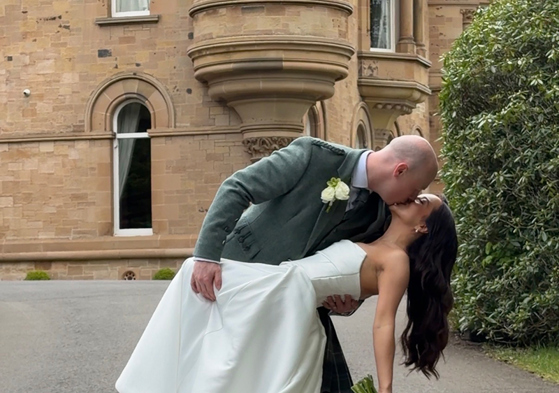 Navae Creative wedding content creator close-up of a bride and groom kissing under a wedding veil