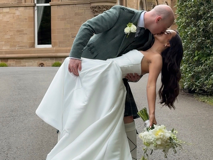 Navae Creative wedding content creator close-up of a bride and groom kissing under a wedding veil