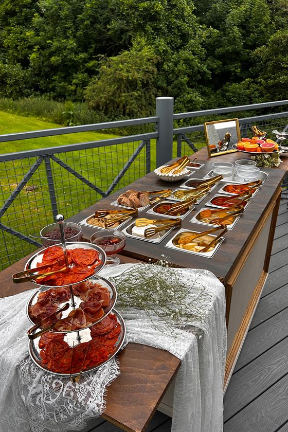 Wedding grazing table with charcuterie, cheeses and accompaniments by Scottish caterer Bramble & Brie