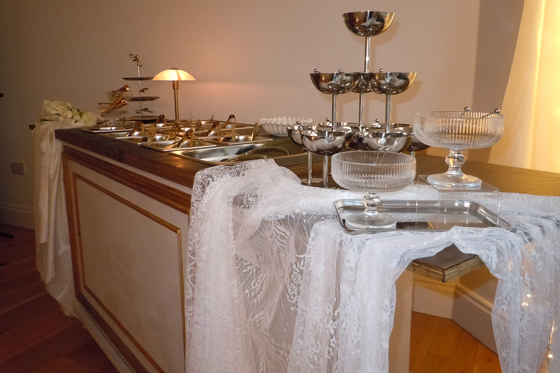 Indoor wedding grazing cart setup by Bramble & Brie with elegant serving dishes and warm lighting