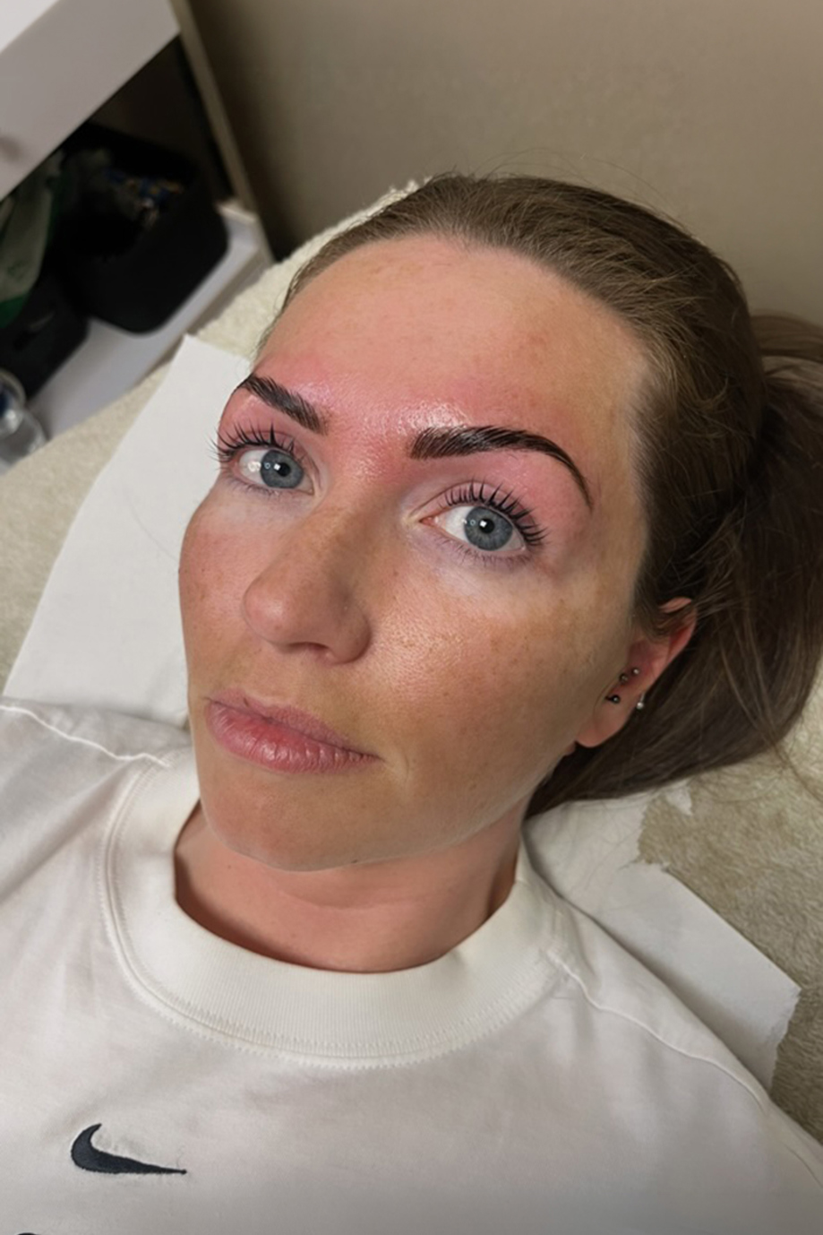 Close-up of a Browz & Bronze by Leah client following a professional eyebrow shaping and tint treatment.