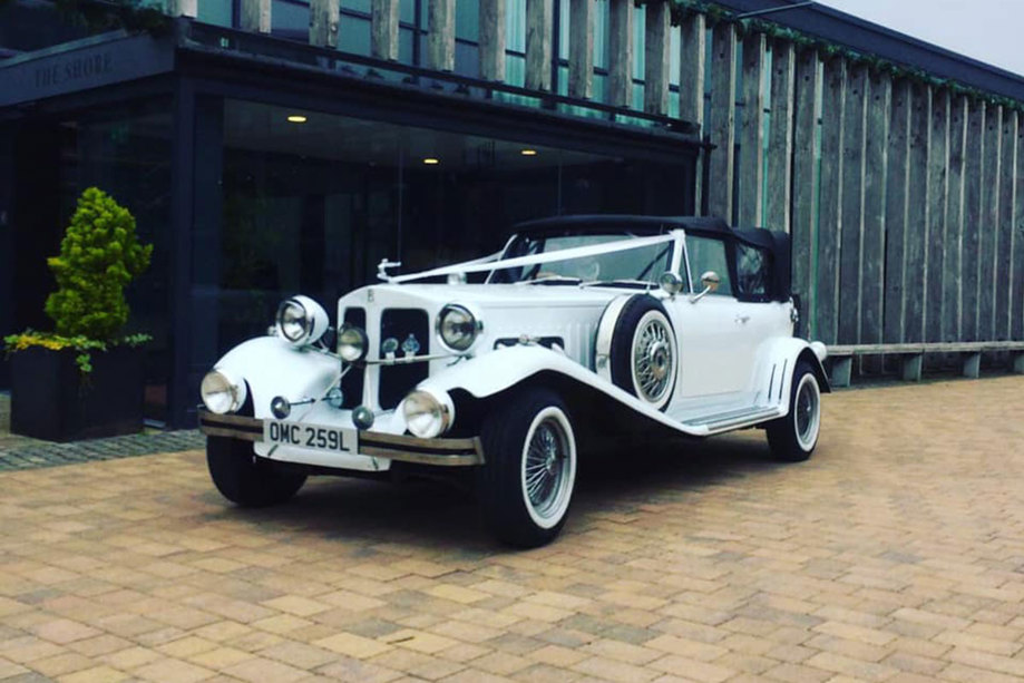 White Beauford with white ribbon