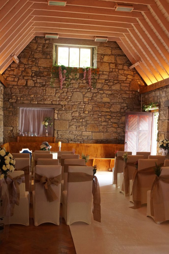 Intimate ceremony set-up with vaulted ceiling.