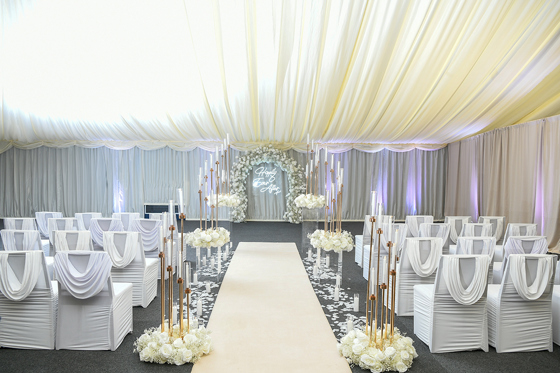 Draped ceiling and white rose decorated intimate ceremony at Geilsland Estate.