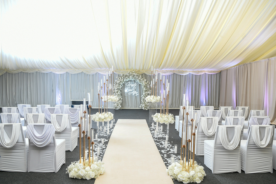 Draped ceiling and white rose decorated intimate ceremony at Geilsland Estate.