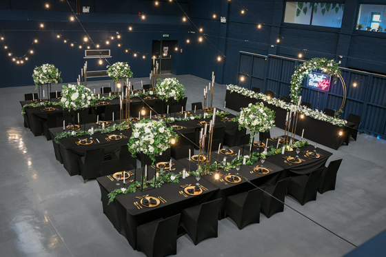 Black and white rose decorated wedding meal at Geilsland Estate.