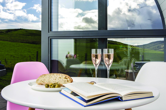 Celebrate on the decking with two glasses of rosé and some snacks at Maycroft Retreat.