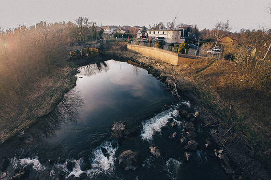 External view of The River Inn in Renfrewshire, showing the River Gryffe nearby.