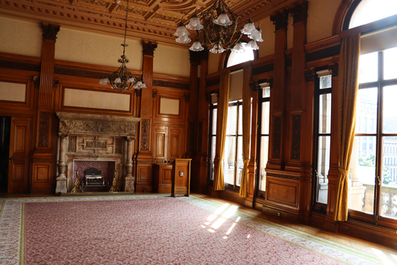 Historic ceremony room in City Chambers, with chendliers and arched windows