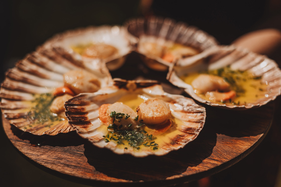 Seared scallops served as part of a luxury wedding dining experience at Broomholm Manor.