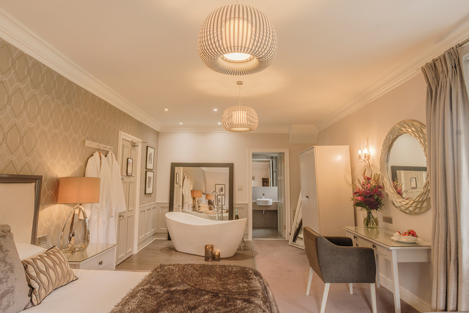 Honeymoon suite at Piersland House with freestanding bath, dressing area and contemporary neutral décor