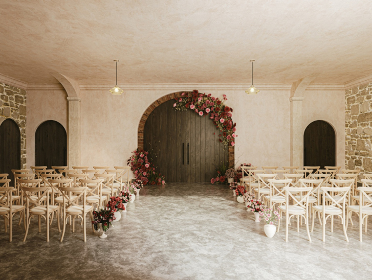 Garden Room at The West Works Glasgow set for a wedding ceremony, with wooden chairs and red and pink floral arrangements around the arched doors