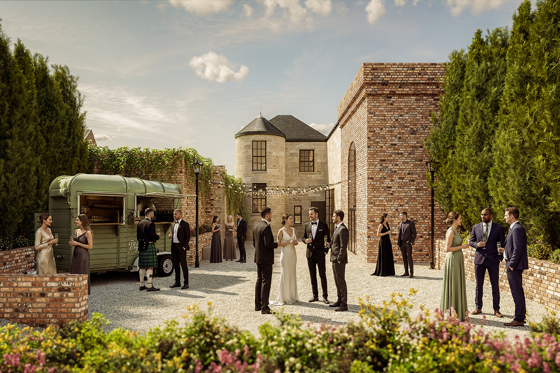 Wedding drinks reception in the walled garden at The West Works Glasgow, with guests gathered beside a mobile bar and festoon lights