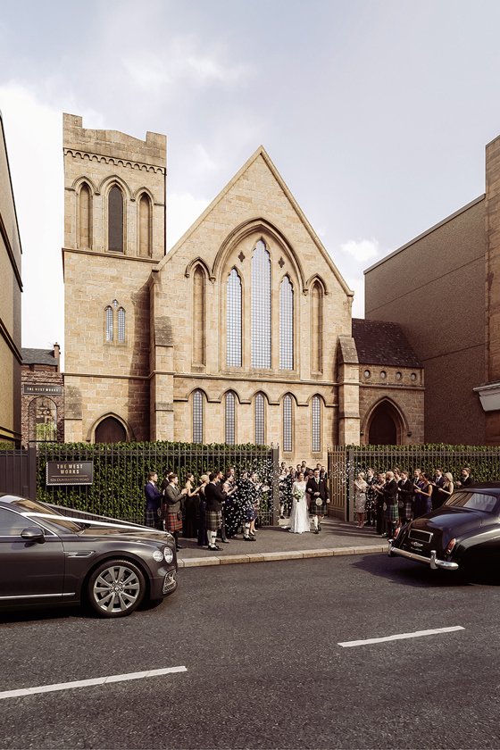 Newlyweds leaving The West Works Glasgow as wedding guests throw confetti outside the historic stone entrance