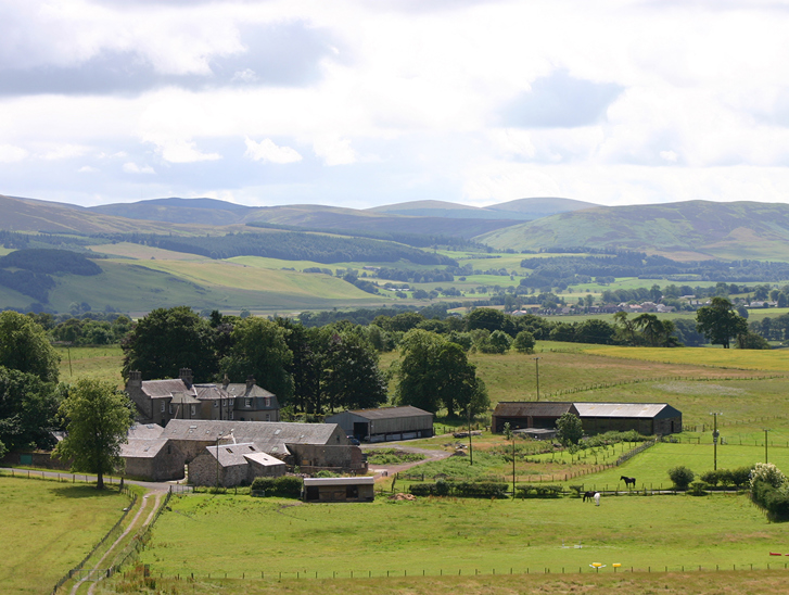 Wide countryside view of Cormiston Farm and surrounding fields in the Clyde Valley