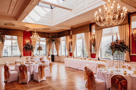 Wedding meal set up with chandeliers and flowers