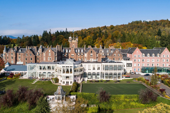 Crieff Hydro external view with grounds in foreground and hills in background
