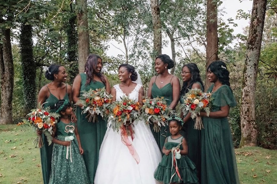 bridebridesmaidsemeraldgreenwoodland.jpg Bride with bridesmaids in emerald green dresses and autumn bouquets in the woodland grounds at Dalgarven House