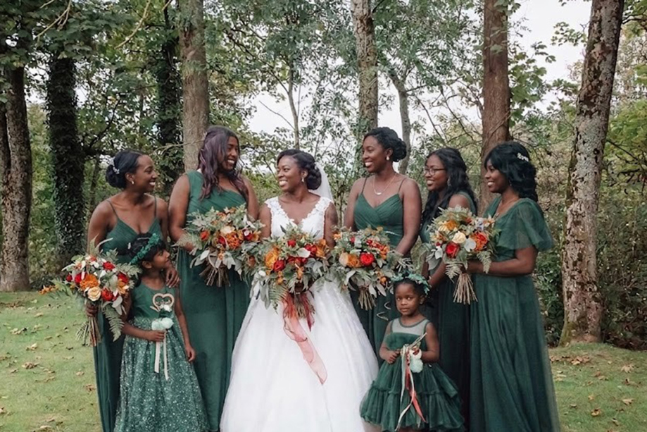 bridebridesmaidsemeraldgreenwoodland.jpg Bride with bridesmaids in emerald green dresses and autumn bouquets in the woodland grounds at Dalgarven House