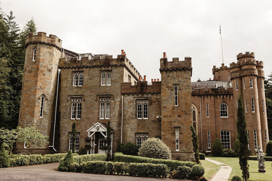 Drumtochty Castle exterior in Aberdeenshire, a historic Scottish baronial castle wedding venue surrounded by woodland.