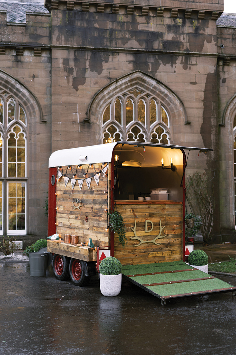 Rustic horsebox bar set up outside Drumtochty Castle for a Scottish castle wedding reception.