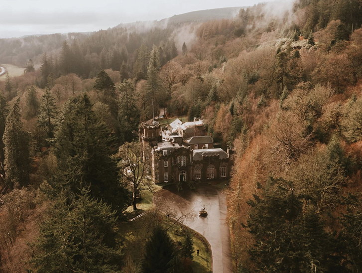 Drumtochty Castle and surrounding woodlands photographed from above.